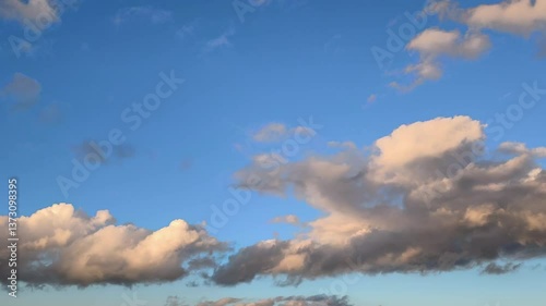 The moon is visible as orange and dark clouds circulate across the sky