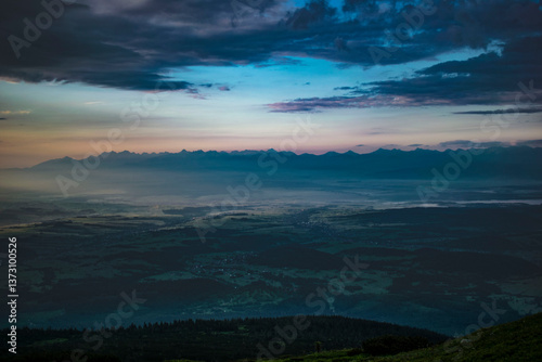 Fototapeta Naklejka Na Ścianę i Meble -  cloudy sunrise on Babia Góra with a view of the Tatra Mountains panorama