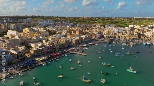 Traditional fishing Marsaxlokk village, boats. Malta island, drone day view