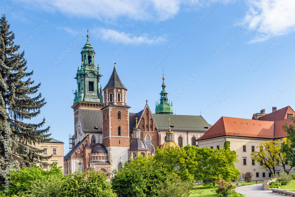 Fototapeta premium Wawel castle on sunny day with blue sky and white clouds