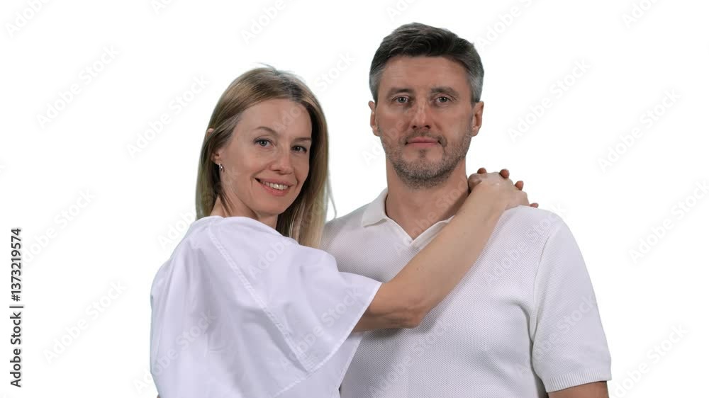 Portrait of middle aged loving couple wearing white clothes looking at camera, Full HD footage with alpha transparency channel isolated on white background Portrait of middle aged loving couple wearing white clothes looking at camera, Full HD footage with alpha transparency channel isolated on white background