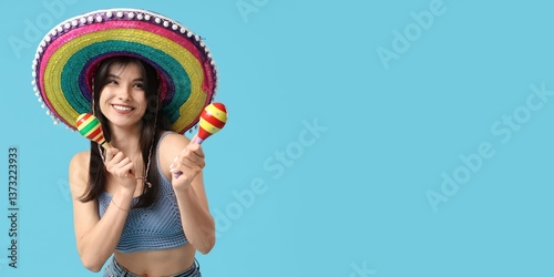 Young woman in sombrero pla...