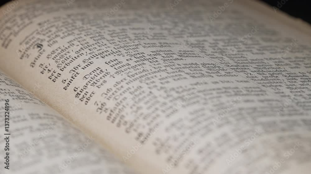 Opened saved old german paper book with Gothic font ancient writings. Worn Pages