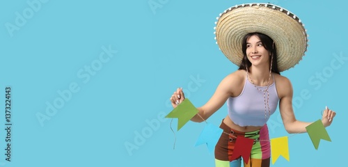 Young woman in sombrero hol...