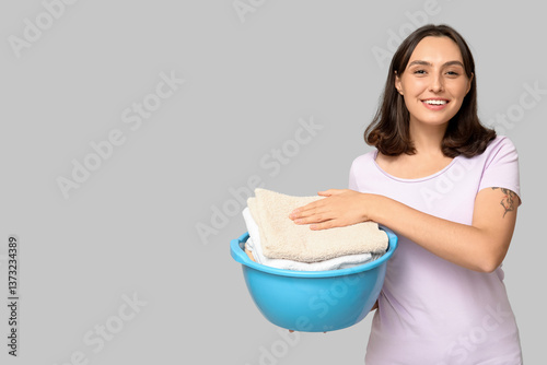 Young woman holding basin w...