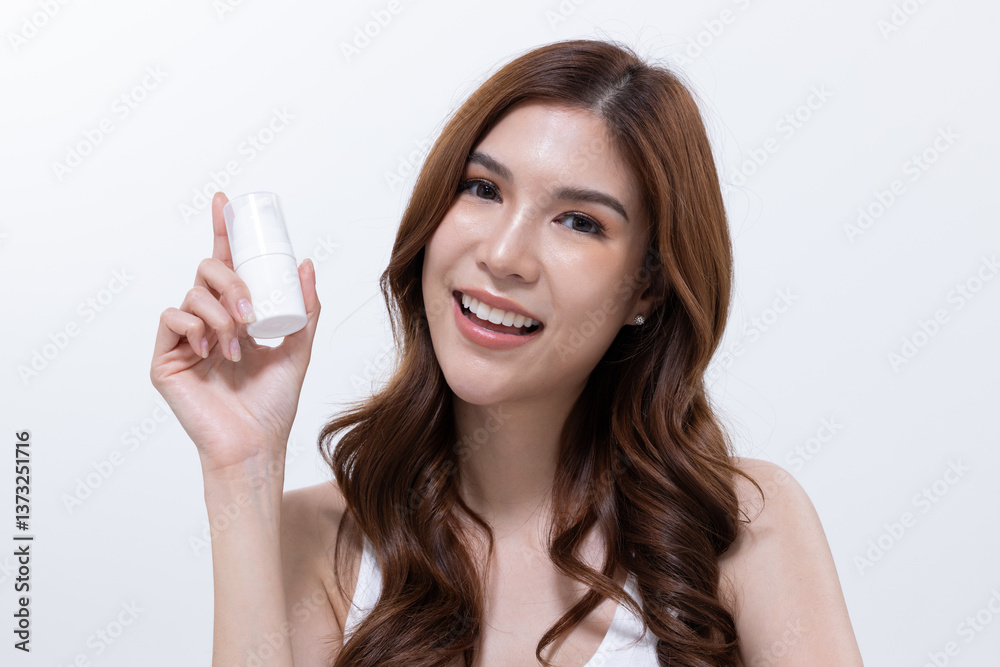 Smiling woman with skincare products on table Smiling woman with skincare products on table