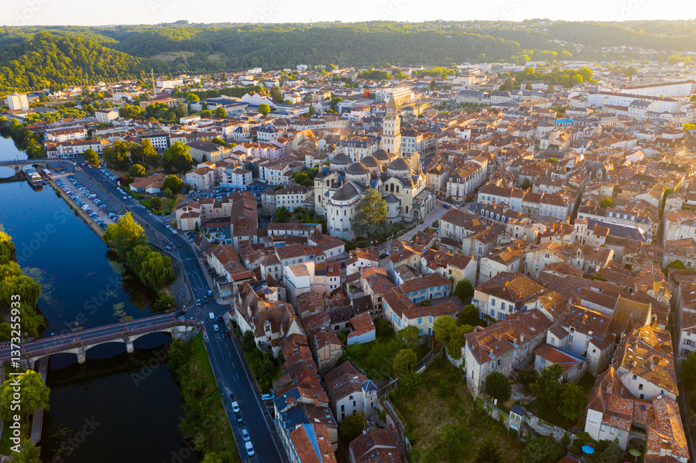 Obraz premium Flight over the evening city of Perigueux at sunset. France