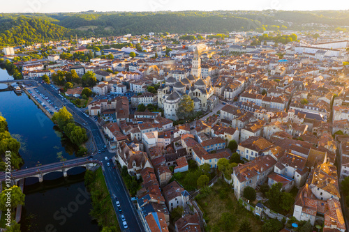 Fototapeta Naklejka Na Ścianę i Meble -  Flight over the evening city of Perigueux at sunset. France