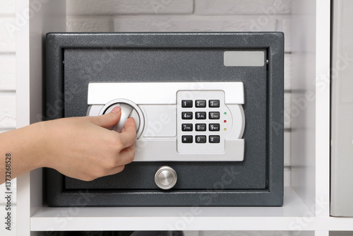 Woman opening safe on shelf...