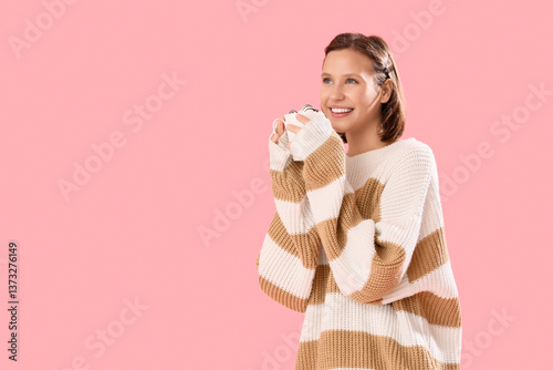 Young woman in striped swea...