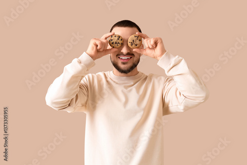 Young man with cookies on b...