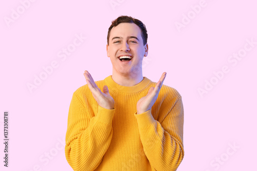 Handsome young happy man on color background