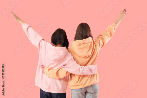 Teenage girls hugging on pi...
