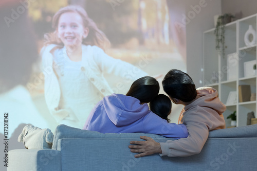 Family watching movie toget...