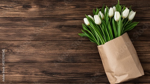 Arranging white tulips in brown paper bag kitchen table floral art cozy environment top view nature inspiration