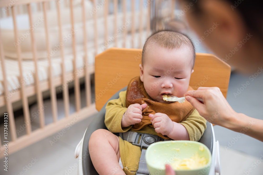 Baby eating healthy food at mealtime