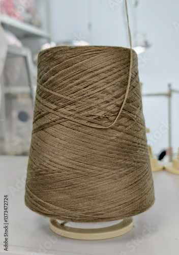 stranded yarn on a knitting machine, in the knitting process