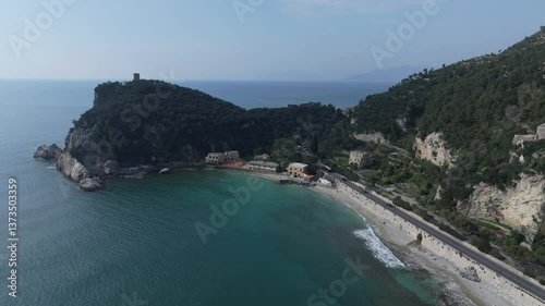 coastal lookout in northwestern Italy near Spiaggia del Malpasso and the clear coastal waters near the highway and picturesque cliffs photo