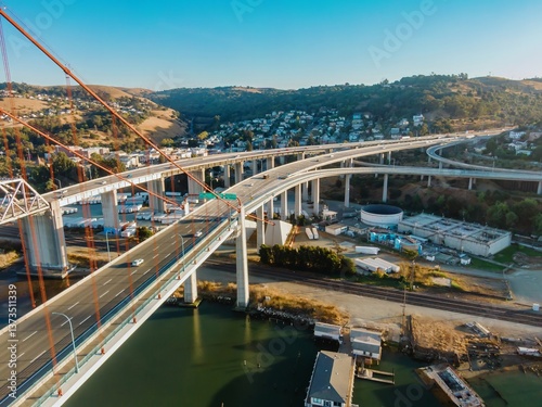 Tableau sur toile An aerial view shows the Alfred Zampa Memorial Bridge in California, USA, carrying cars and trucks across the Carquinez Strait, connecting Contra Costa and Solano counties