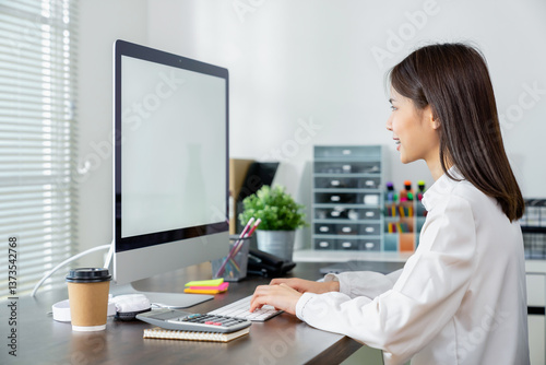 Business woman hand using computer and type on the keyboard. Mockup screen of advertisement.