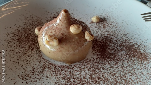 фотографія Hazelnut dessert with focus on the foreground of the gourmet dish in Italy