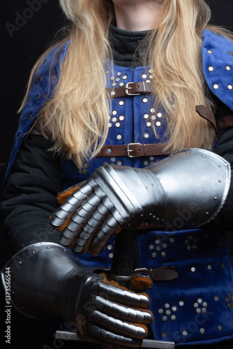 Medieval Knight Holding Sword in Full Armor