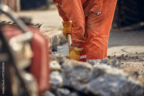 Construction worker working on a public city road reconstruction
