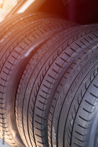 Set of summer tires inside open car trunk