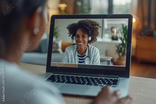 A person participates in a virtual health counseling session, interacting with a supportive therapist on a laptop. The setting is cozy and conducive for therapy, enhancing the experience.