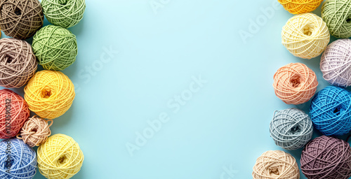 Multiple colorful yarn balls placed on left and right edges on light blue background, forming a hobby concept with creative space in the center. Ai generative photo