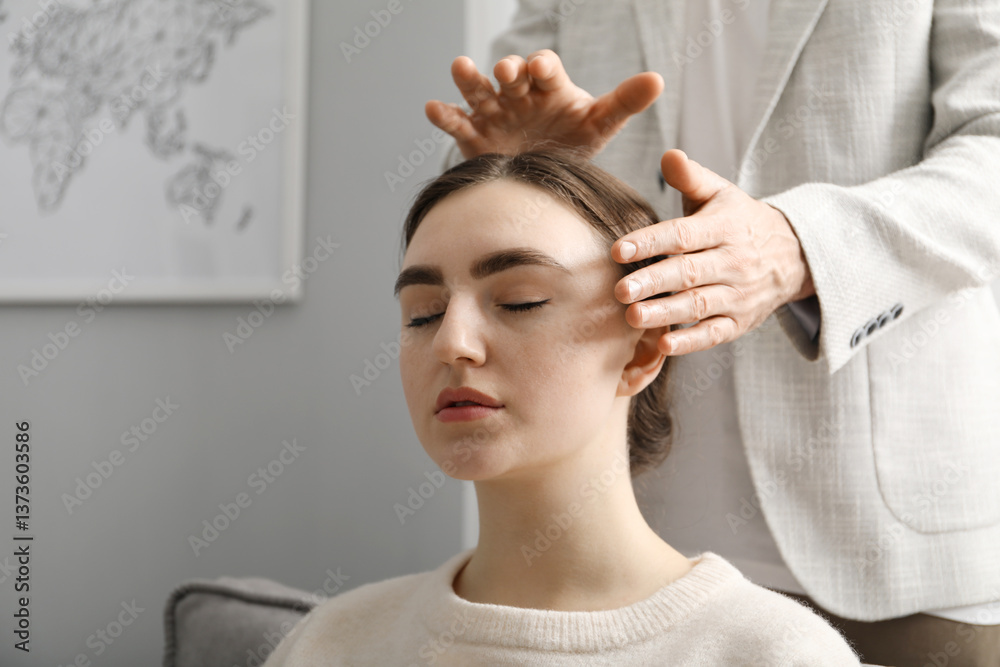Psychologist working with patient during hypnosis session indoors, closeup. Space for text
