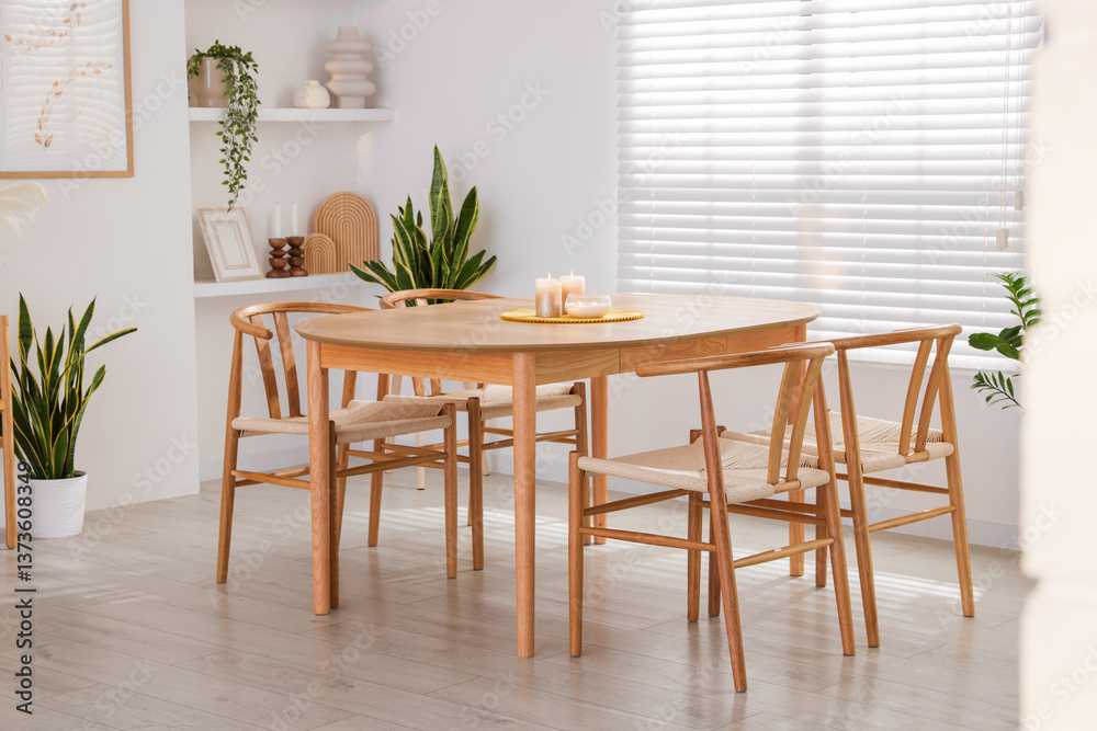 Obraz premium Stylish wooden table with chairs and decor indoors. Interior design