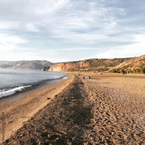 Fototapeta Naklejka Na Ścianę i Meble -  Sandy beach of the Mediterranean Sea. Gazipasa Beach. Beach in Turkey. Caretta turtle beach