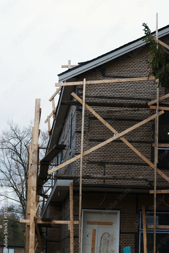 Fototapeta premium scaffolding on house under construction