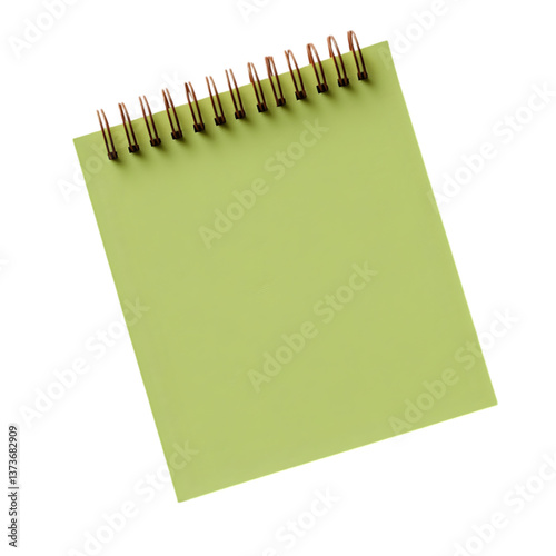 A close up of a light green notepad with a spiral binding on a black background in studio lighting