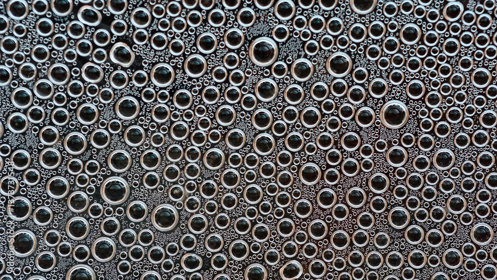 Water bubbles macro texture on dark background.