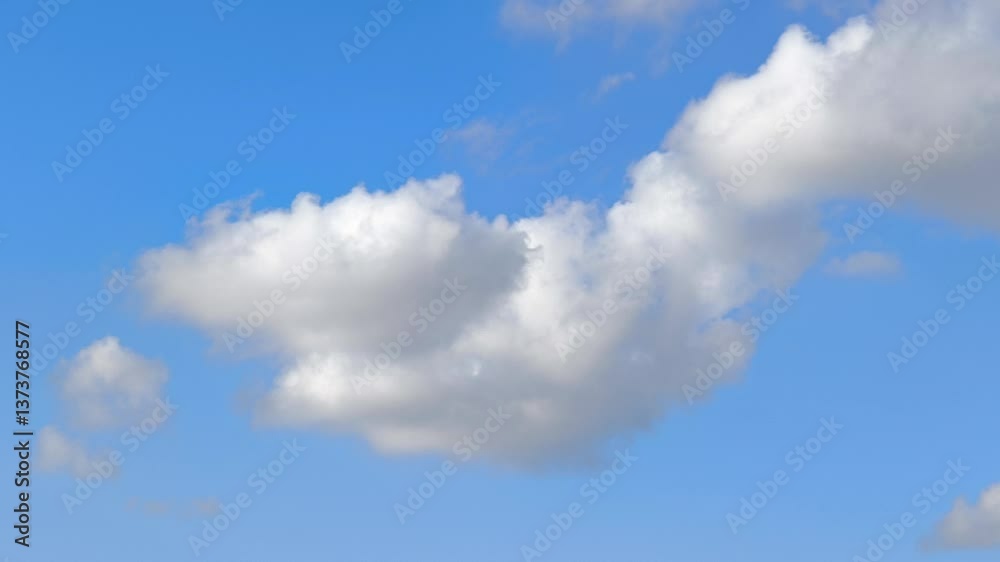 Golden-hued cumulus clouds moving at sunset Golden-hued cumulus clouds moving at sunset