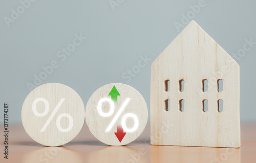 Wooden blocks show percentages, special offers, department store discounts and tax concepts. Adjust interest rates. Increase interest rates to fight inflation. Financial investment returns.