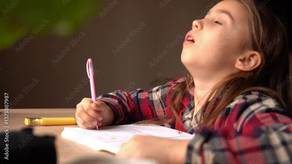 Young girl struggles with homework at a table in a cozy room during the afternoon