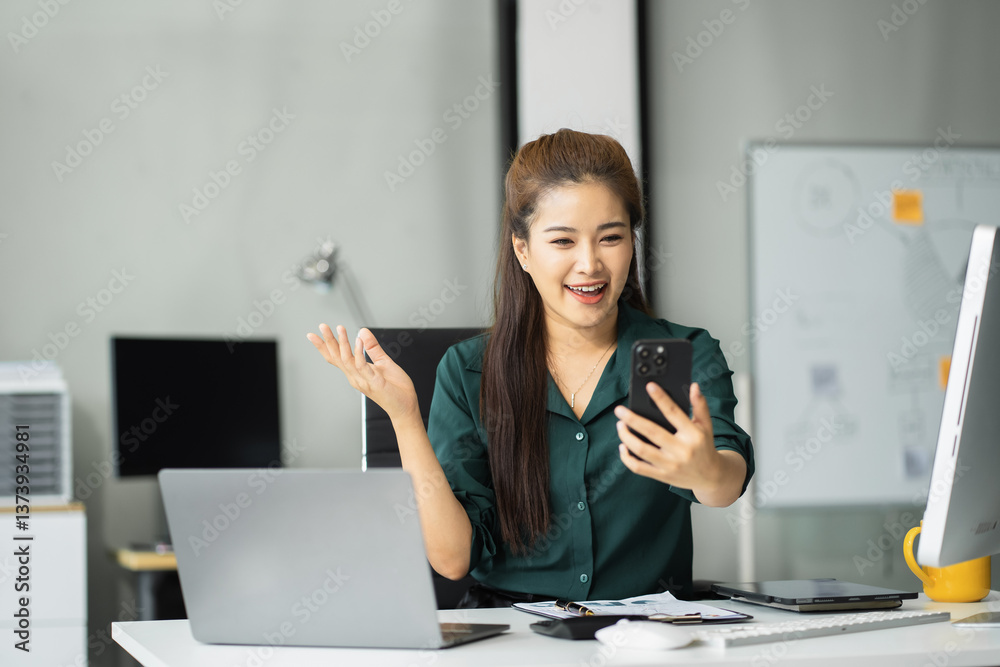 Happy businesswoman having fun social media doing live streaming using smartphone or laptop during free time. Happy businesswoman having fun social media doing live streaming using smartphone or laptop during free time.