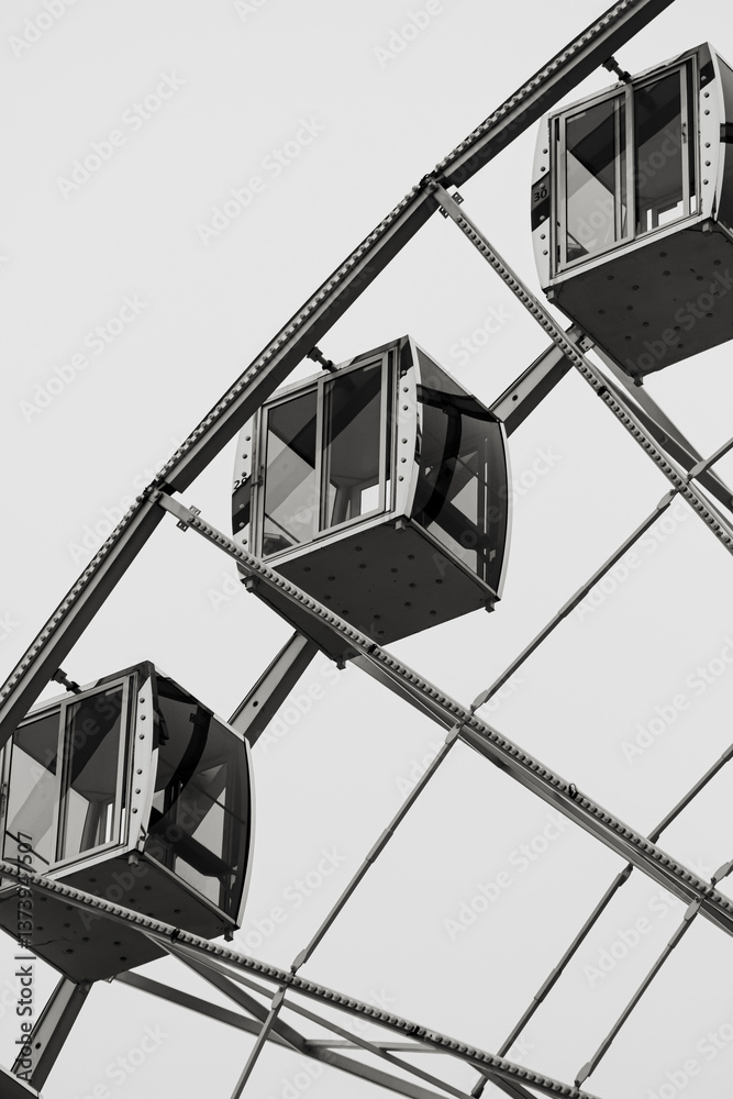 Black and white farther photo in perspective of a Ferris wheel cabins at the Kontraktova Square in Kyiv, Ukraine. January 23, 2025. Shows the tectonics of steel. Use for magazines, books, wallpaper Black and white farther photo in perspective of a Ferris wheel cabins at the Kontraktova Square in Kyiv, Ukraine. January 23, 2025. Shows the tectonics of steel. Use for magazines, books, wallpaper