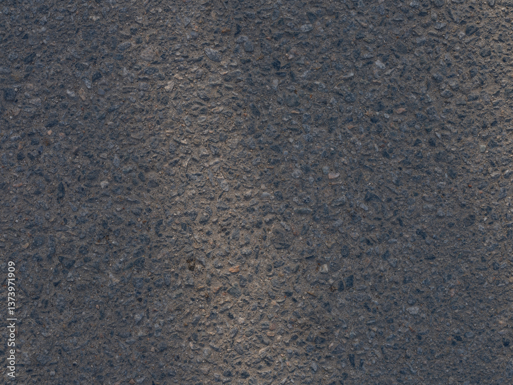 Fototapeta premium Close-up of asphalt surface rough texture with small stones.