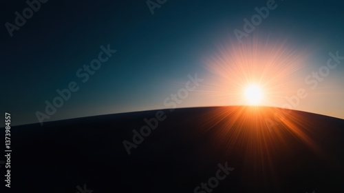 A stunning horizon with the sun setting, casting a warm glow and radiant lens flare against a darkening sky, evoking a sense of calm and wonder.