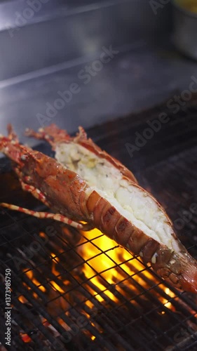 Grilling lobster tail over flames outdoor kitchen culinary art gourmet experience close-up view seafood delight for summer feasts
