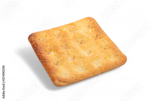 Single golden-brown sugar cracker, square-shaped, casting a soft shadow on a white background.