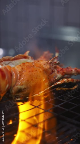 Grilling lobster tail over flames outdoor kitchen culinary art gourmet experience close-up view seafood delight for summer feasts