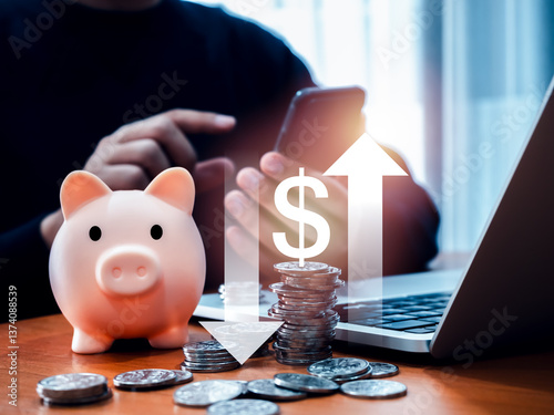 Wallpaper Mural Foreign exchange rates, saving account, stock and financial, Investment plan concept. Piggy bank and many coin, with cost of dollar with arrow down and up, and man using application on smartphone. Torontodigital.ca