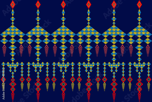 Ikat is a seamless shawl or waist wrap made of blue and yellow diamond squares with red and yellow tassels on a dark blue background.