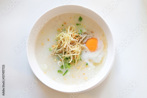 Delicious Asian Rice Porridge (Congee) with Egg and Toppings