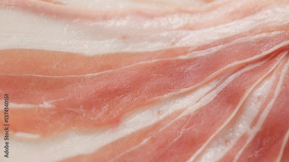 Texture of thin raw pork belly slices rotating. Close up view Texture of thin raw pork belly slices rotating. Close up view